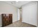 Bedroom featuring neutral walls, carpet, closet, and a furnished cabinet at 221 Hilltop Bloom Loop, Haines City, FL 33844