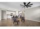 Open-concept living room featuring modern kitchen with stainless steel appliances and tile flooring throughout at 221 Hilltop Bloom Loop, Haines City, FL 33844