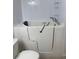 Bathroom featuring a walk-in tub, shower handle, and built-in storage shelves at 2235 Grand Cypress Dr # 561, Lakeland, FL 33810