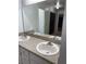 Bathroom featuring double sinks with updated fixtures and a large vanity mirror at 2235 Grand Cypress Dr # 561, Lakeland, FL 33810