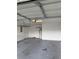 Attached garage featuring concrete floors and white walls at 2235 Grand Cypress Dr # 561, Lakeland, FL 33810