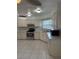 Bright kitchen featuring stainless steel appliances, white cabinets, and tile flooring at 2235 Grand Cypress Dr # 561, Lakeland, FL 33810