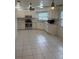 Spacious kitchen features white cabinets, tile flooring, and stainless steel appliances at 2235 Grand Cypress Dr # 561, Lakeland, FL 33810