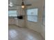White cabinets and tile flooring accent this bright kitchen with stainless appliances at 2235 Grand Cypress Dr # 561, Lakeland, FL 33810