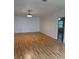 Open living area features wood-look flooring and bright, neutral paint at 2235 Grand Cypress Dr # 561, Lakeland, FL 33810