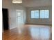 Bright living room featuring hardwood floors and large windows that let in lots of natural light at 2235 Grand Cypress Dr # 561, Lakeland, FL 33810