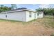 The backyard features a modern building with a sliding glass door at 2517 Sunset Dr, Winter Haven, FL 33881