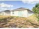 The backyard features a modern building with a sliding glass door at 2517 Sunset Dr, Winter Haven, FL 33881
