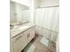 Clean bathroom showcasing granite counters and a tiled shower at 2517 Sunset Dr, Winter Haven, FL 33881