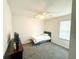 A simple, well-lit bedroom with a ceiling fan and ample space at 2517 Sunset Dr, Winter Haven, FL 33881