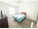 Cozy bedroom with a ceiling fan and light-filled window at 2517 Sunset Dr, Winter Haven, FL 33881
