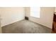 Empty bedroom with neutral carpet and ample natural light at 2517 Sunset Dr, Winter Haven, FL 33881