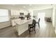 Bright and modern kitchen with an island, stainless steel appliances, and an adjacent dining area at 2517 Sunset Dr, Winter Haven, FL 33881