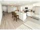 Open-concept kitchen with an island, stainless steel appliances, and seamless flow to living spaces at 2517 Sunset Dr, Winter Haven, FL 33881