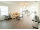 Open-concept living room featuring light-colored flooring and easy access to the kitchen at 2517 Sunset Dr, Winter Haven, FL 33881