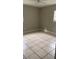 Inviting bedroom with neutral walls, window, and tiled floors at 2708 Dixie Rd, Lakeland, FL 33801