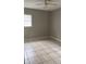 Comfortable bedroom featuring a window, neutral walls and a ceiling fan at 2708 Dixie Rd, Lakeland, FL 33801