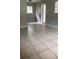 Spacious living room featuring neutral walls, tiled floor, and natural light from windows at 2708 Dixie Rd, Lakeland, FL 33801