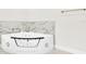 Luxurious bathtub with marble backsplash at 2736 Sunrise Landing Ln, Lakeland, FL 33812