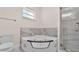 Bathroom features a modern soaking tub and glass enclosed shower at 2736 Sunrise Landing Ln, Lakeland, FL 33812