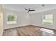 Bright bedroom features hardwood floors, recessed lighting and large windows with natural light at 2736 Sunrise Landing Ln, Lakeland, FL 33812