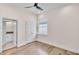 Bright bedroom features wood floors and en suite bathroom access at 2736 Sunrise Landing Ln, Lakeland, FL 33812