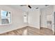 Bright bedroom with wood-look floors, windows, and en suite bathroom at 2736 Sunrise Landing Ln, Lakeland, FL 33812