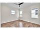 A bright bedroom with three large windows, recessed lights and a ceiling fan at 2736 Sunrise Landing Ln, Lakeland, FL 33812