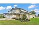 A shot of this home's exterior with manicured lawn and landscaping at 2736 Sunrise Landing Ln, Lakeland, FL 33812