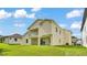 Exterior view of a home with a large backyard and covered patios at 2736 Sunrise Landing Ln, Lakeland, FL 33812