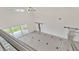 Large foyer with high ceilings, tile floors with black accents, sliding glass doors and modern lighting at 2736 Sunrise Landing Ln, Lakeland, FL 33812