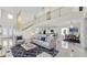 Open-concept living room featuring high ceilings, a modern staircase, and comfortable seating arrangements at 2736 Sunrise Landing Ln, Lakeland, FL 33812