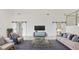 Elegant living room with comfortable seating, contemporary decor, and barn doors for added charm at 2736 Sunrise Landing Ln, Lakeland, FL 33812