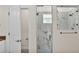 Glass-enclosed shower showcasing modern tile and fixtures at 2736 Sunrise Landing Ln, Lakeland, FL 33812