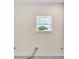 A window in an unfinished bedroom shows tree and sky views at 2736 Sunrise Landing Ln, Lakeland, FL 33812
