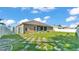 Spacious backyard with a well-maintained lawn, enclosed by a tall white fence at 2812 Whitney St, Lakeland, FL 33813