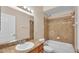 Bathroom featuring a shower over tub, a granite vanity and a well-lit mirror at 2812 Whitney St, Lakeland, FL 33813