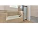 Bright bathroom featuring a soaking tub with tile surround and a glass shower enclosure at 2812 Whitney St, Lakeland, FL 33813