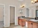 Bathroom with double sink vanity, lots of cabinet space, and separate toilet area at 2812 Whitney St, Lakeland, FL 33813