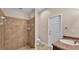 Bathroom with tiled shower, a toilet and sink at 2812 Whitney St, Lakeland, FL 33813