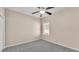 Carpeted bedroom with a ceiling fan at 2812 Whitney St, Lakeland, FL 33813