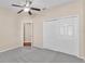 Bedroom featuring a ceiling fan and closet at 2812 Whitney St, Lakeland, FL 33813