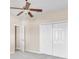 Bedroom featuring a ceiling fan and a closet at 2812 Whitney St, Lakeland, FL 33813