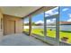 An enclosed patio, featuring ample sunlight and views of the backyard and fence at 2812 Whitney St, Lakeland, FL 33813