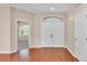 Bright foyer boasts hardwood floors, high ceilings, and a large double-door entryway with natural light at 2812 Whitney St, Lakeland, FL 33813