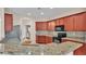 Spacious kitchen featuring granite countertops, stainless steel appliances, and stylish backsplash at 2812 Whitney St, Lakeland, FL 33813