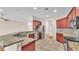 Open kitchen with granite countertops, stainless steel appliances, and tile flooring at 2812 Whitney St, Lakeland, FL 33813