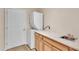 Functional laundry room with washer, dryer, sink, and ample counter space at 2812 Whitney St, Lakeland, FL 33813