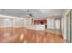 Spacious living area boasting hardwood floors, a ceiling fan, and open layout at 2812 Whitney St, Lakeland, FL 33813