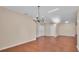 Bright living room features hardwood floors, high ceilings, a chandelier, and natural light at 2812 Whitney St, Lakeland, FL 33813
